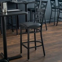 Lancaster Table & Seating Black Finish Cross Back Bar Stool With 2 1/2" Black Vinyl Padded Seat