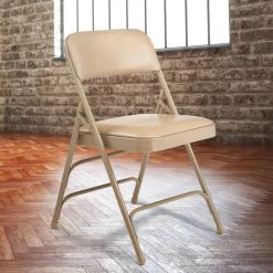 National Public Seating 1301 Beige Metal Folding Chair With 1 1/4" French Beige Vinyl Padded Seat