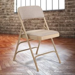 National Public Seating 2301 Beige Metal Folding Chair With 1 1/4" Cafe Beige Fabric Padded Seat