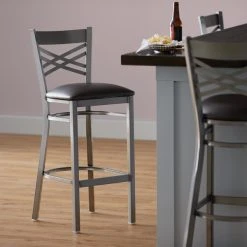 Lancaster Table & Seating Clear Coat Finish Cross Back Bar Stool With 2 1/2" Dark Brown Vinyl Padded Seat