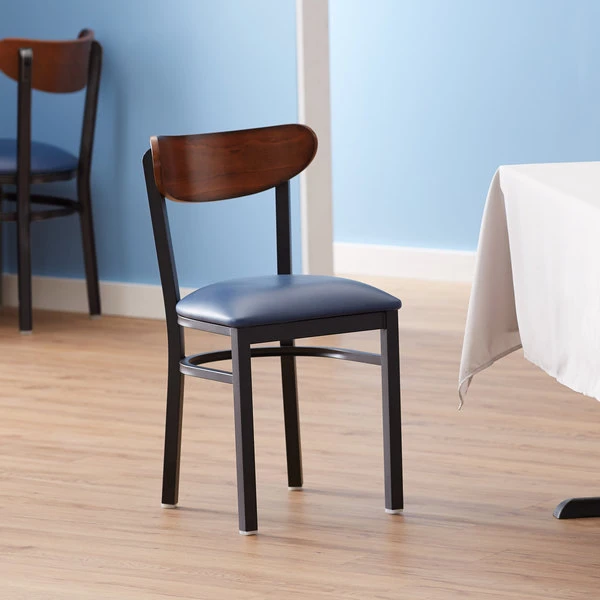 LT&S Boomerang Series Lancaster Table & Seating Boomerang Black Finish Chair With 2 1/2" Navy Vinyl Padded Seat And Antique Walnut Wood Back 1 LT&S Boomerang Series Lancaster Table & Seating Boomerang Black Finish Chair With 2 1/2" Navy Vinyl Padded Seat And Antique Walnut Wood Back