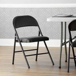 Lancaster Table & Seating Black Vinyl Folding Chair With Padded Seat