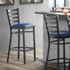 Lancaster Table & Seating Black Finish Ladder Back Bar Stool With 2 1/2" Navy Blue Vinyl Padded Seat