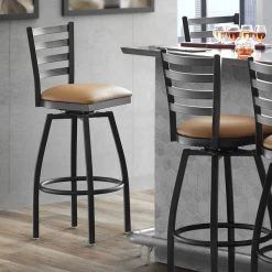 Lancaster Table & Seating Black Finish Ladder Back Swivel Bar Stool With 2 1/2" Light Brown Vinyl Padded Seat