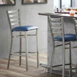 Lancaster Table & Seating Clear Coat Finish Ladder Back Bar Stool With 2 1/2" Navy Blue Vinyl Padded Seat