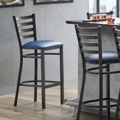 Lancaster Table & Seating Distressed Copper Finish Ladder Back Bar Stool With 2 1/2" Navy Blue Vinyl Padded Seat