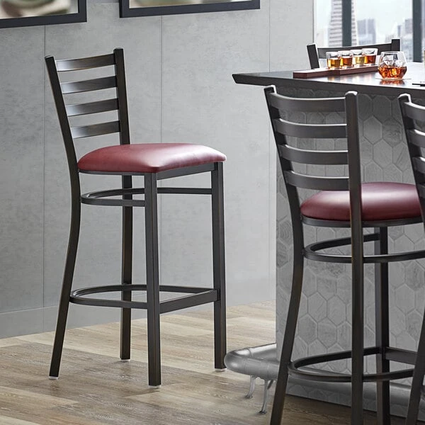 Lancaster Table & Seating Distressed Copper Finish Ladder Back Bar Stool With 2 1/2" Burgundy Vinyl Padded Seat 1 Lancaster Table & Seating Distressed Copper Finish Ladder Back Bar Stool With 2 1/2" Burgundy Vinyl Padded Seat
