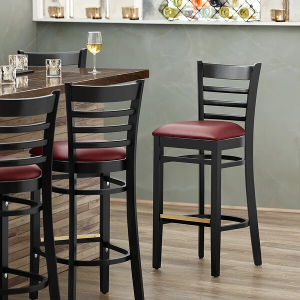 Lancaster Table & Seating Black Ladder Back Bar Height Chair With Burgundy Padded Seat 1 Lancaster Table & Seating Black Ladder Back Bar Height Chair With Burgundy Padded Seat