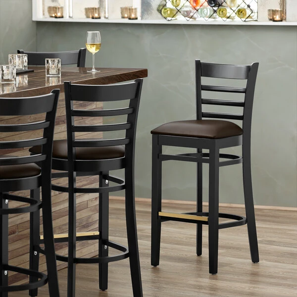 Lancaster Table & Seating Black Ladder Back Bar Height Chair With Dark Brown Padded Seat 1 Lancaster Table & Seating Black Ladder Back Bar Height Chair With Dark Brown Padded Seat