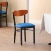 LT&S Boomerang Series Lancaster Table & Seating Boomerang Black Finish Chair With 2 1/2" Blue Vinyl Padded Seat And Cherry Wood Back