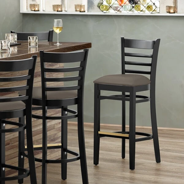 Lancaster Table & Seating Black Finish Wooden Ladder Back Bar Height Chair With Taupe Padded Seat 1 Lancaster Table & Seating Black Finish Wooden Ladder Back Bar Height Chair With Taupe Padded Seat