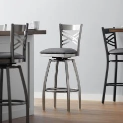 Lancaster Table & Seating Clear Coat Finish Cross Back Swivel Bar Stool With 2 1/2" Dark Gray Vinyl Padded Seat
