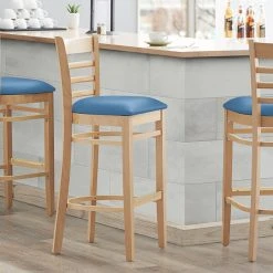 Lancaster Table & Seating Natural Finish Wooden Ladder Back Bar Height Chair With Blue Padded Seat