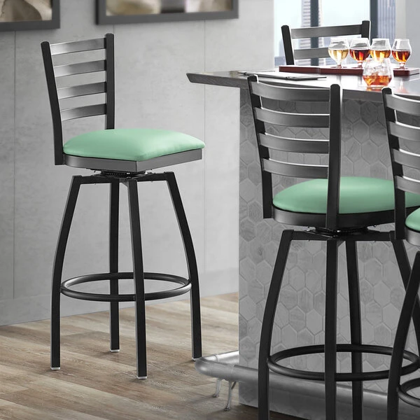 Lancaster Table & Seating Black Finish Ladder Back Swivel Bar Stool With 2 1/2" Seafoam Vinyl Padded Seat 1 Lancaster Table & Seating Black Finish Ladder Back Swivel Bar Stool With 2 1/2" Seafoam Vinyl Padded Seat