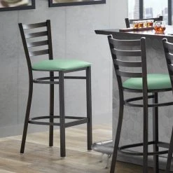 Lancaster Table & Seating Distressed Copper Finish Ladder Back Bar Stool With 2 1/2" Seafoam Vinyl Padded Seat