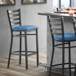 Lancaster Table & Seating Black Finish Ladder Back Bar Stool With 2 1/2" Blue Vinyl Padded Seat