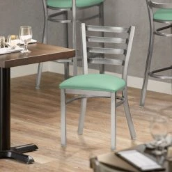 Lancaster Table & Seating Clear Coat Finish Ladder Back Chair With 2 1/2" Seafoam Vinyl Padded Seat