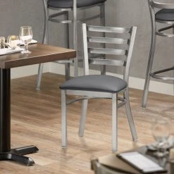 Lancaster Table & Seating Clear Coat Finish Ladder Back Chair With 2 1/2" Dark Gray Vinyl Padded Seat