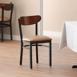 LT&S Boomerang Series Lancaster Table & Seating Boomerang Black Finish Chair With 2 1/2" Light Brown Vinyl Padded Seat And Antique Walnut Wood Back