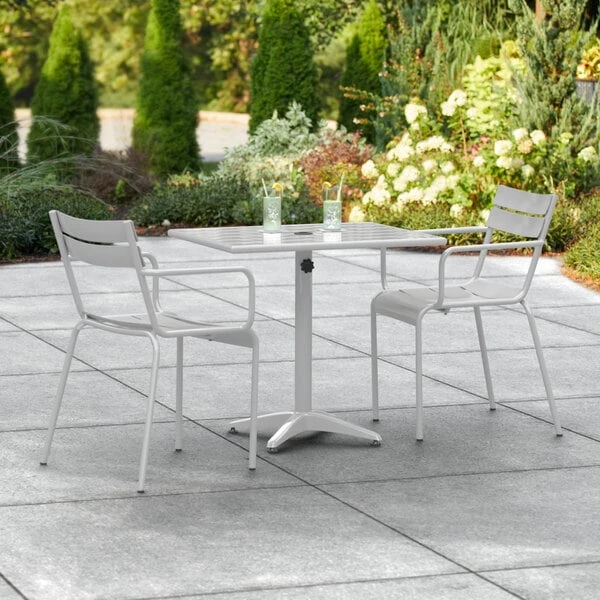 Lancaster Table & Seating 24" X 32" Silver Powder-Coated Aluminum Dining Height Outdoor Table With Umbrella Hole And 2 Arm Chairs 1 Lancaster Table & Seating 24" X 32" Silver Powder-Coated Aluminum Dining Height Outdoor Table With Umbrella Hole And 2 Arm Chairs