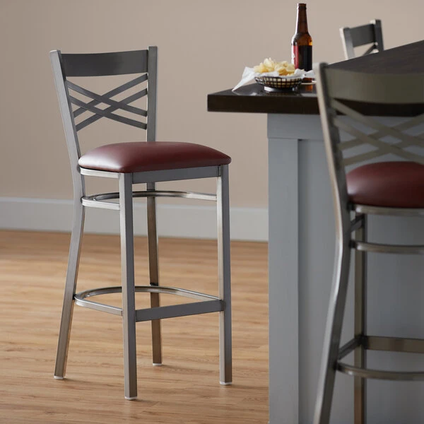 Lancaster Table & Seating Clear Coat Finish Cross Back Bar Stool With 2 1/2" Burgundy Vinyl Padded Seat 1 Lancaster Table & Seating Clear Coat Finish Cross Back Bar Stool With 2 1/2" Burgundy Vinyl Padded Seat