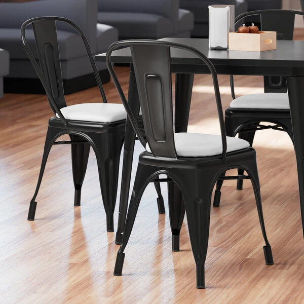 LT&S Alloy Series Lancaster Table & Seating Alloy Series Black Metal Indoor Cafe Chair With White Vinyl Cushion 1 LT&S Alloy Series Lancaster Table & Seating Alloy Series Black Metal Indoor Cafe Chair With White Vinyl Cushion