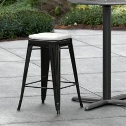 LT&S Alloy Series Lancaster Table & Seating Alloy Series Black Stackable Metal Indoor / Outdoor Industrial Cafe Counter Height Stool With Gray Fabric Magnetic Cushion