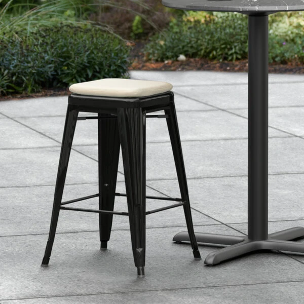 LT&S Alloy Series Lancaster Table & Seating Alloy Series Black Stackable Metal Indoor / Outdoor Industrial Cafe Counter Height Stool With Tan Fabric Magnetic Cushion 1 LT&S Alloy Series Lancaster Table & Seating Alloy Series Black Stackable Metal Indoor / Outdoor Industrial Cafe Counter Height Stool With Tan Fabric Magnetic Cushion