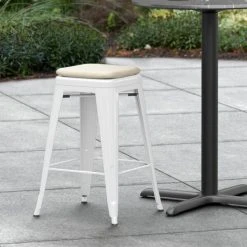 LT&S Alloy Series Lancaster Table & Seating Alloy Series White Stackable Metal Indoor / Outdoor Industrial Cafe Counter Height Stool With Tan Fabric Magnetic Cushion
