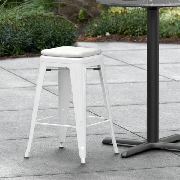 LT&S Alloy Series Lancaster Table & Seating Alloy Series White Stackable Metal Indoor / Outdoor Industrial Cafe Counter Height Stool With Gray Fabric Magnetic Cushion 1 LT&S Alloy Series Lancaster Table & Seating Alloy Series White Stackable Metal Indoor / Outdoor Industrial Cafe Counter Height Stool With Gray Fabric Magnetic Cushion