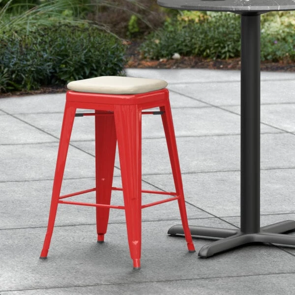 LT&S Alloy Series Lancaster Table & Seating Alloy Series Red Stackable Metal Indoor / Outdoor Industrial Cafe Counter Height Stool With Tan Fabric Magnetic Cushion 1 LT&S Alloy Series Lancaster Table & Seating Alloy Series Red Stackable Metal Indoor / Outdoor Industrial Cafe Counter Height Stool With Tan Fabric Magnetic Cushion