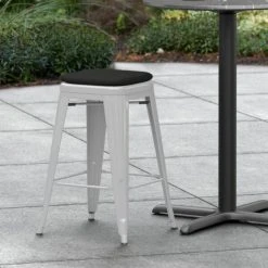 LT&S Alloy Series Lancaster Table & Seating Alloy Series Silver Stackable Metal Indoor / Outdoor Industrial Cafe Counter Height Stool With Black Fabric Magnetic Cushion