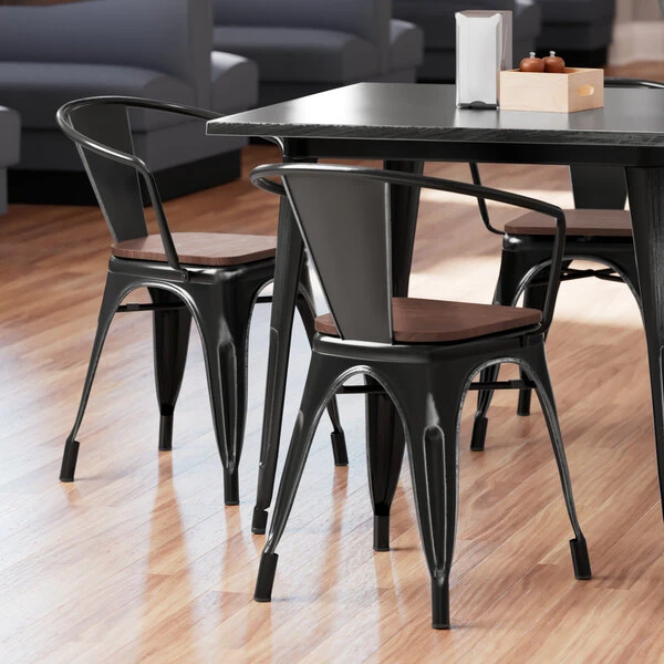 LT&S Alloy Series Lancaster Table & Seating Alloy Series Distressed Black Metal Indoor Industrial Cafe Arm Chair With Vertical Slat Back And Walnut Wood Seat 1 LT&S Alloy Series Lancaster Table & Seating Alloy Series Distressed Black Metal Indoor Industrial Cafe Arm Chair With Vertical Slat Back And Walnut Wood Seat