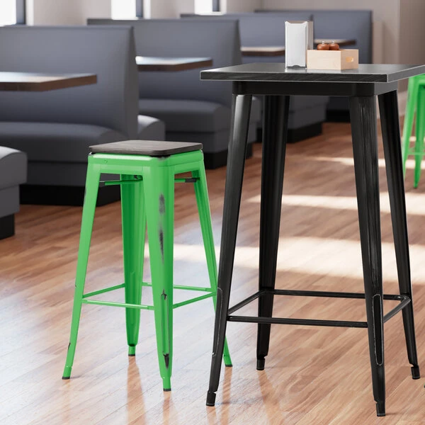 LT&S Alloy Series Lancaster Table & Seating Alloy Series Distressed Green Stackable Metal Indoor Industrial Barstool With Black Wood Seat 1 LT&S Alloy Series Lancaster Table & Seating Alloy Series Distressed Green Stackable Metal Indoor Industrial Barstool With Black Wood Seat