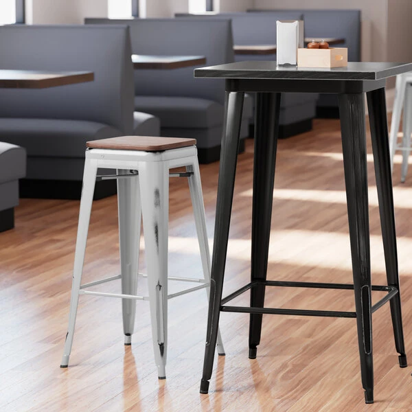LT&S Alloy Series Lancaster Table & Seating Alloy Series Distressed Silver Stackable Metal Indoor Industrial Barstool With Walnut Wood Seat 1 LT&S Alloy Series Lancaster Table & Seating Alloy Series Distressed Silver Stackable Metal Indoor Industrial Barstool With Walnut Wood Seat