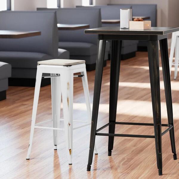LT&S Alloy Series Lancaster Table & Seating Alloy Series Distressed White Stackable Metal Indoor Industrial Barstool With Gray Wood Seat 1 LT&S Alloy Series Lancaster Table & Seating Alloy Series Distressed White Stackable Metal Indoor Industrial Barstool With Gray Wood Seat