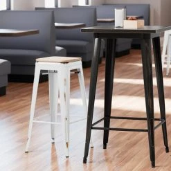 LT&S Alloy Series Lancaster Table & Seating Alloy Series Distressed White Stackable Metal Indoor Industrial Barstool With Natural Wood Seat