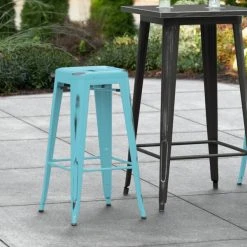 LT&S Alloy Series Lancaster Table & Seating Alloy Series Distressed Arctic Blue Stackable Metal Indoor / Outdoor Industrial Barstool With Drain Hole Seat