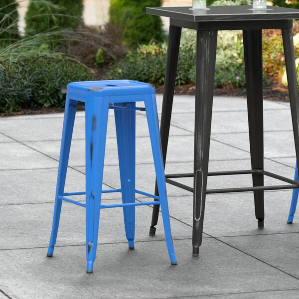 LT&S Alloy Series Lancaster Table & Seating Alloy Series Distressed Blue Stackable Metal Indoor / Outdoor Industrial Barstool With Drain Hole Seat 1 LT&S Alloy Series Lancaster Table & Seating Alloy Series Distressed Blue Stackable Metal Indoor / Outdoor Industrial Barstool With Drain Hole Seat