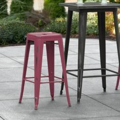 LT&S Alloy Series Lancaster Table & Seating Alloy Series Distressed Sangria Stackable Metal Indoor / Outdoor Industrial Barstool With Drain Hole Seat