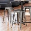 LT&S Alloy Series Lancaster Table & Seating Alloy Series Clear Coated Metal Indoor Industrial Cafe Counter Height Stool With Black Wood Seat