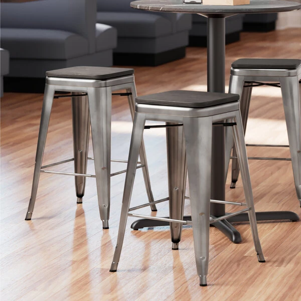 LT&S Alloy Series Lancaster Table & Seating Alloy Series Clear Coated Metal Indoor Industrial Cafe Counter Height Stool With Black Wood Seat 1 LT&S Alloy Series Lancaster Table & Seating Alloy Series Clear Coated Metal Indoor Industrial Cafe Counter Height Stool With Black Wood Seat