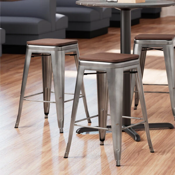 LT&S Alloy Series Lancaster Table & Seating Alloy Series Clear Coated Metal Indoor Industrial Cafe Counter Height Stool With Walnut Wood Seat 1 LT&S Alloy Series Lancaster Table & Seating Alloy Series Clear Coated Metal Indoor Industrial Cafe Counter Height Stool With Walnut Wood Seat