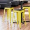LT&S Alloy Series Lancaster Table & Seating Alloy Series Yellow Metal Indoor Industrial Cafe Counter Height Stool With Black Wood Seat