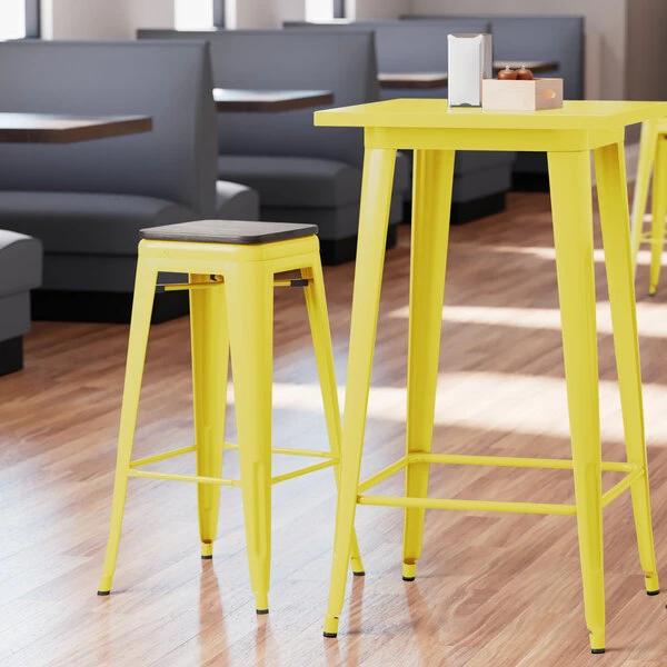 LT&S Alloy Series Lancaster Table & Seating Alloy Series Yellow Metal Indoor Industrial Cafe Bar Height Stool With Black Wood Seat 1 LT&S Alloy Series Lancaster Table & Seating Alloy Series Yellow Metal Indoor Industrial Cafe Bar Height Stool With Black Wood Seat