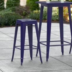 LT&S Alloy Series Lancaster Table & Seating Alloy Series Navy Stackable Metal Indoor / Outdoor Industrial Barstool With Drain Hole Seat