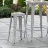 LT&S Alloy Series Lancaster Table & Seating Alloy Series Silver Stackable Metal Indoor / Outdoor Industrial Barstool With Drain Hole Seat