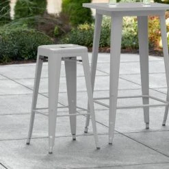 LT&S Alloy Series Lancaster Table & Seating Alloy Series Silver Stackable Metal Indoor / Outdoor Industrial Barstool With Drain Hole Seat