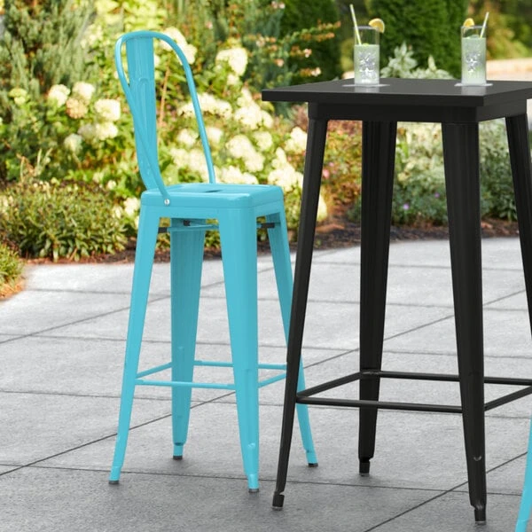 LT&S Alloy Series Lancaster Table & Seating Alloy Series Arctic Blue Metal Indoor / Outdoor Industrial Cafe Barstool With Vertical Slat Back And Drain Hole Seat 1 LT&S Alloy Series Lancaster Table & Seating Alloy Series Arctic Blue Metal Indoor / Outdoor Industrial Cafe Barstool With Vertical Slat Back And Drain Hole Seat