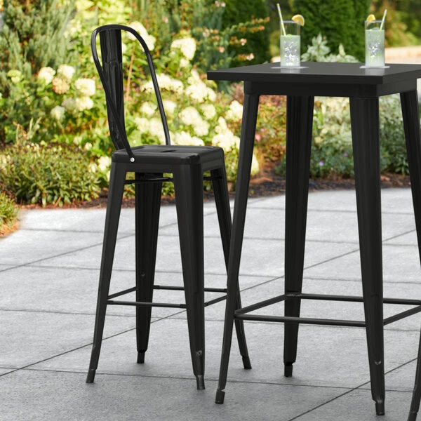 LT&S Alloy Series Lancaster Table & Seating Alloy Series Black Metal Indoor / Outdoor Industrial Cafe Barstool With Vertical Slat Back And Drain Hole Seat 1 LT&S Alloy Series Lancaster Table & Seating Alloy Series Black Metal Indoor / Outdoor Industrial Cafe Barstool With Vertical Slat Back And Drain Hole Seat
